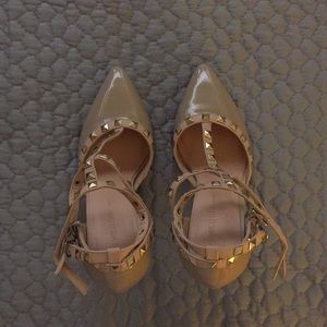 Nude patent leather studded heels